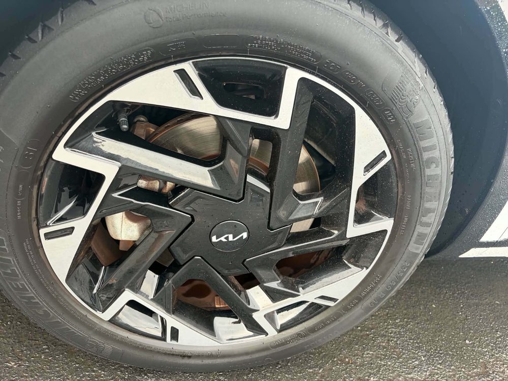 A close up of a cleaned Kia alloy wheel with the spokes and tyre wall detailed